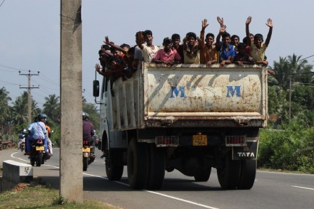 Waving locals from the back of a truck, East Coast, Sri Lanka