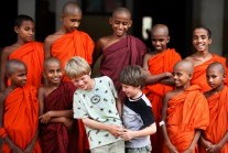 A visiting family made welcome at a Buddhist monastery, Sri Lanka