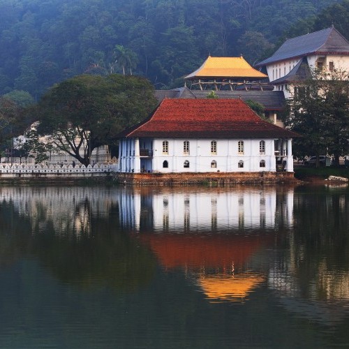 Serene Kandy Lake reflecting the Temple of the Tooth, Kandy, Sri Lanka